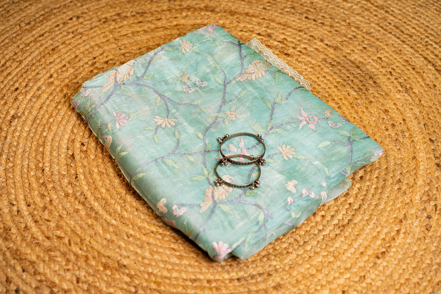 Glass Tissue saree with floral and nature-inspired motifs embroidery