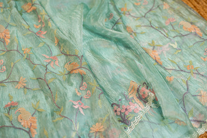 Glass Tissue saree with floral and nature-inspired motifs embroidery